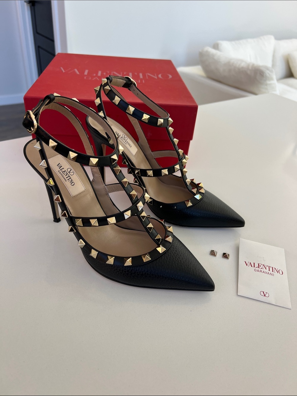 Valentino Garavani black grainy leather gold tone rockstud pointed toe pump heel